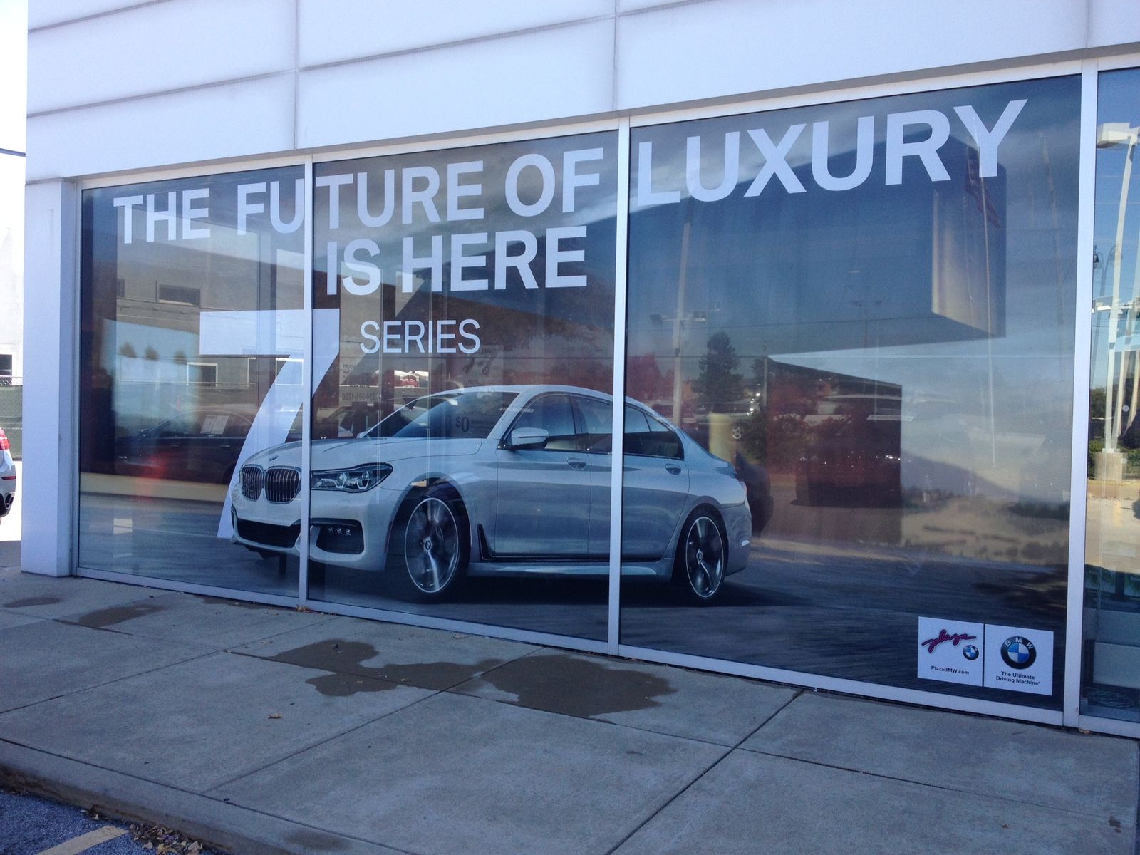 A showroom window graphic with a 7 Series