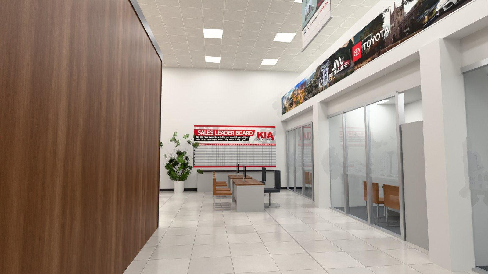 The Dealership Graphics Builder's sales offices with framed graphics and a sales board