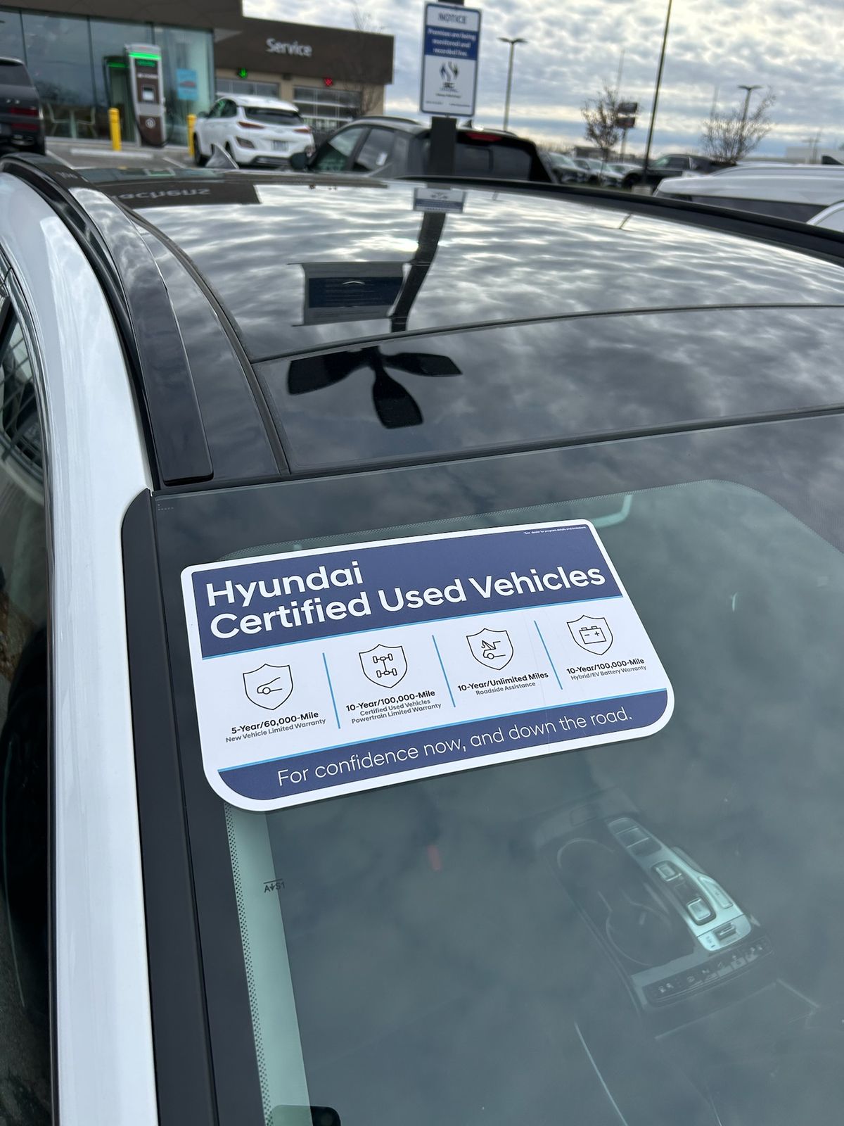 A windshield banner reading Hyundai Certified Used Vehicles