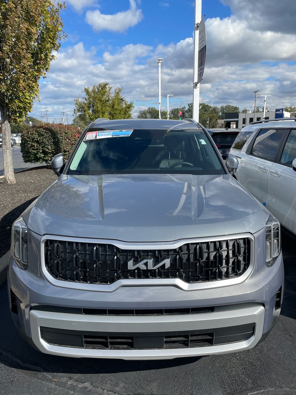 New units on a franchise lot with windshield banners