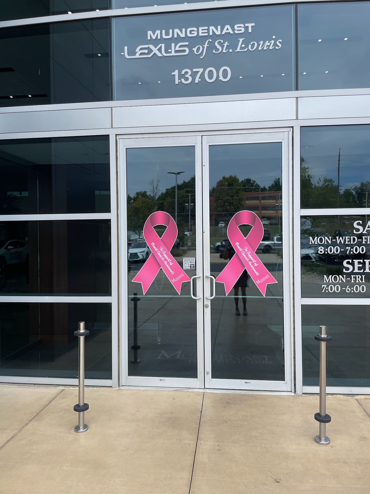 Pink ribbons on showroom doors