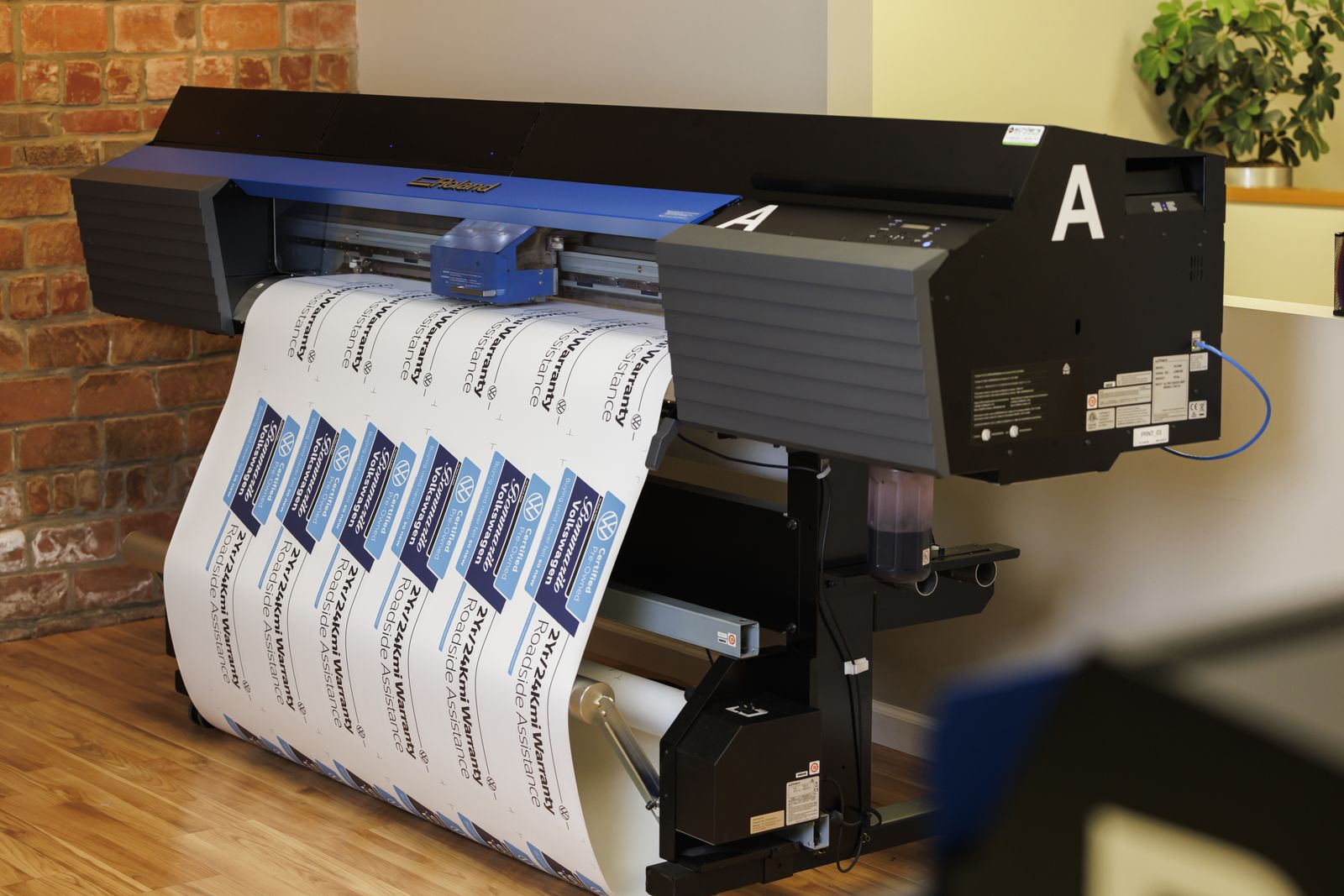 Our printer running a sheet of windshield banners