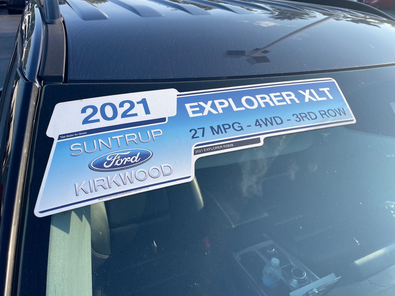 A used-car flyout reading 2021 Explorer XLT