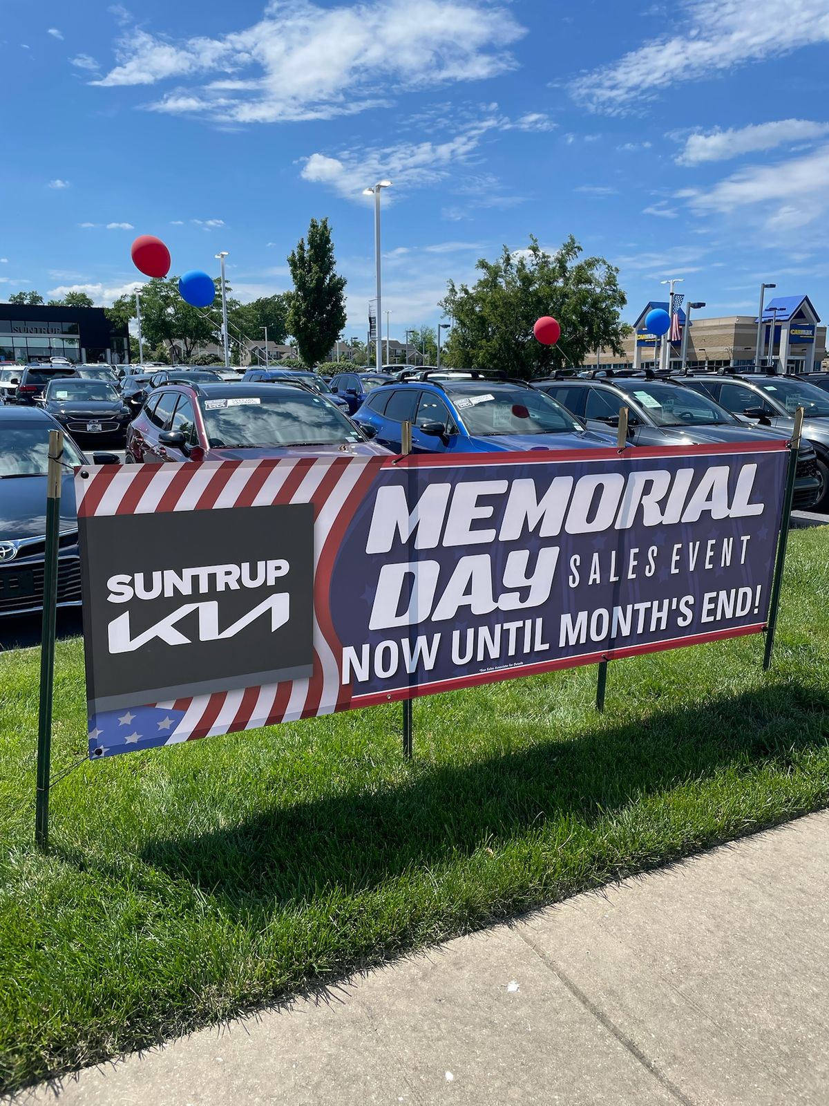A grass banner for a Memorial Day sales event